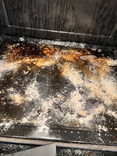 Dirty oven interior before cleaning