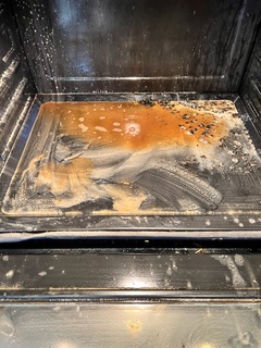 Oven mid-clean during a move-out cleaning