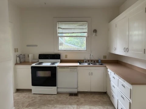 Clean kitchen with wiped counters and appliances