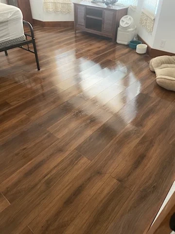 Shining hardwood floors in a freshly cleaned living room