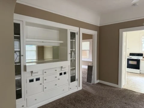 Clean built-in cabinets and dining room